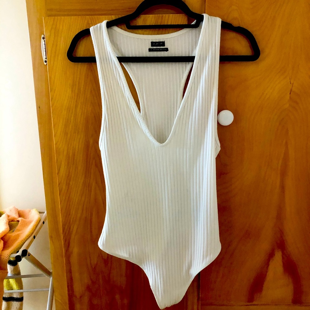 Urban outfitters women’s white body suit- L